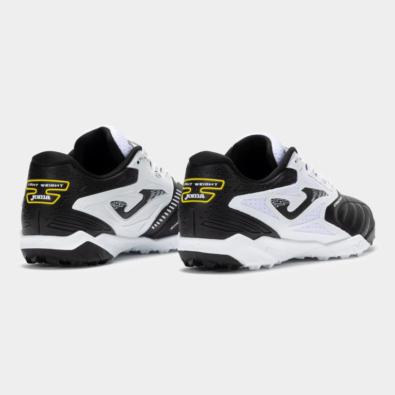 Joma Cancha 2501 white soccer shoes – bottom view of turf outsole with small rubber studs for traction.