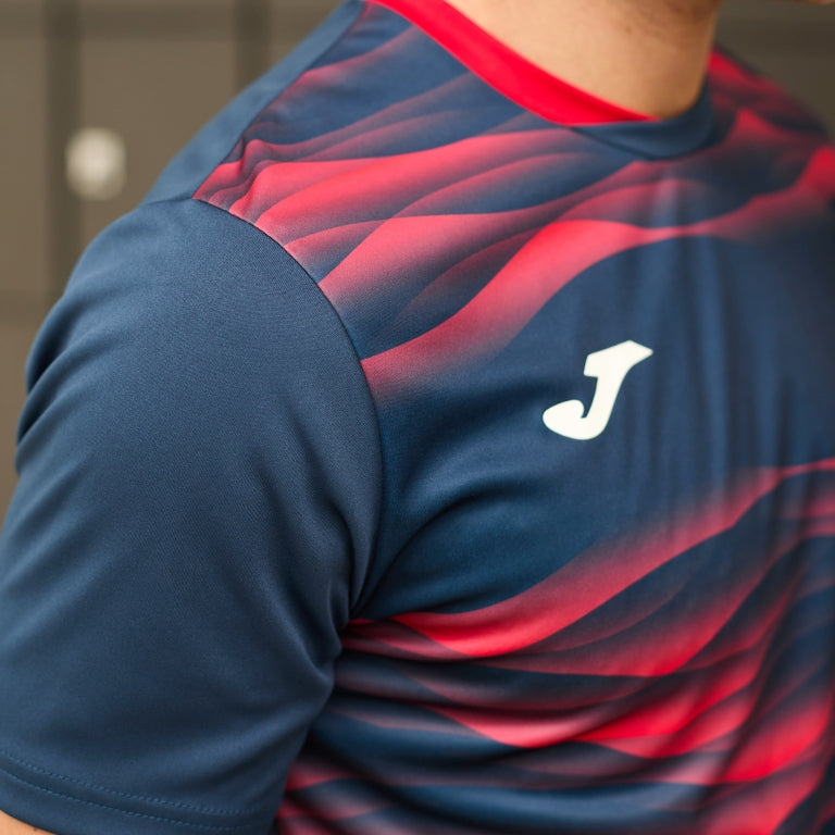 Joma Tiger VII navy soccer jersey flat lay