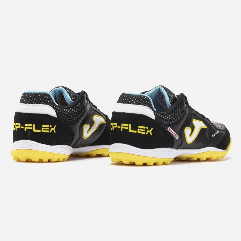 Joma Top Flex 2301 turf shoes in yellow – rear view showing reinforced heel and branded detailing.