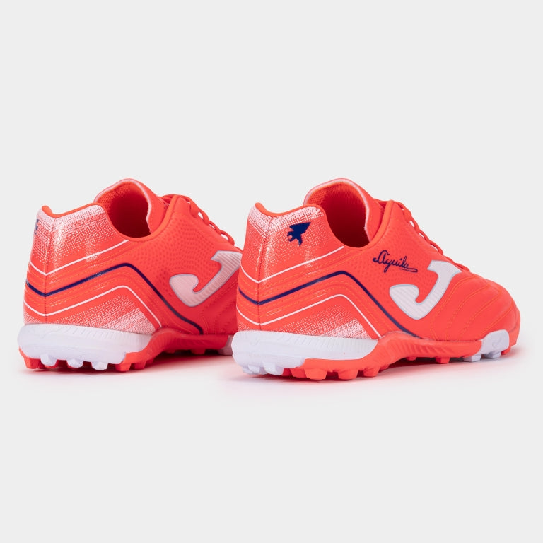 Joma Aguila 2507 turf shoes in orange – rear view showing reinforced heel and brand detailing.