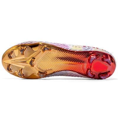 Close-up of a sports shoe sole with gold, red, and multicolor design on a sole view